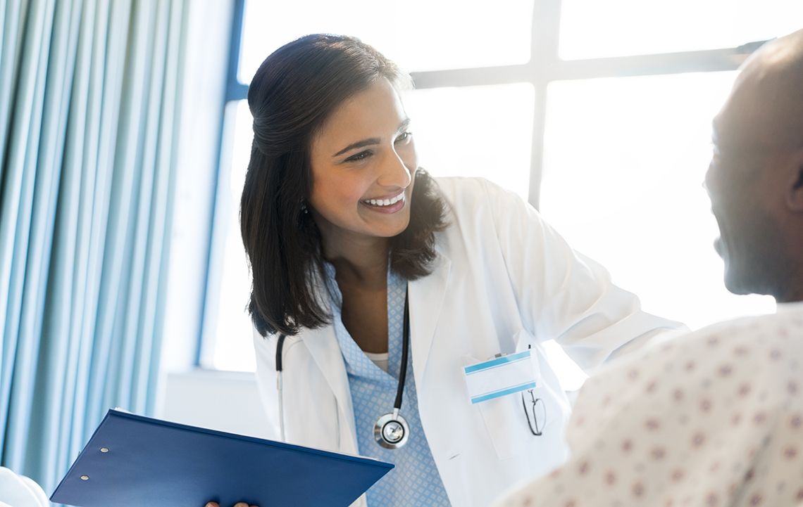 Doctor smiling at patient